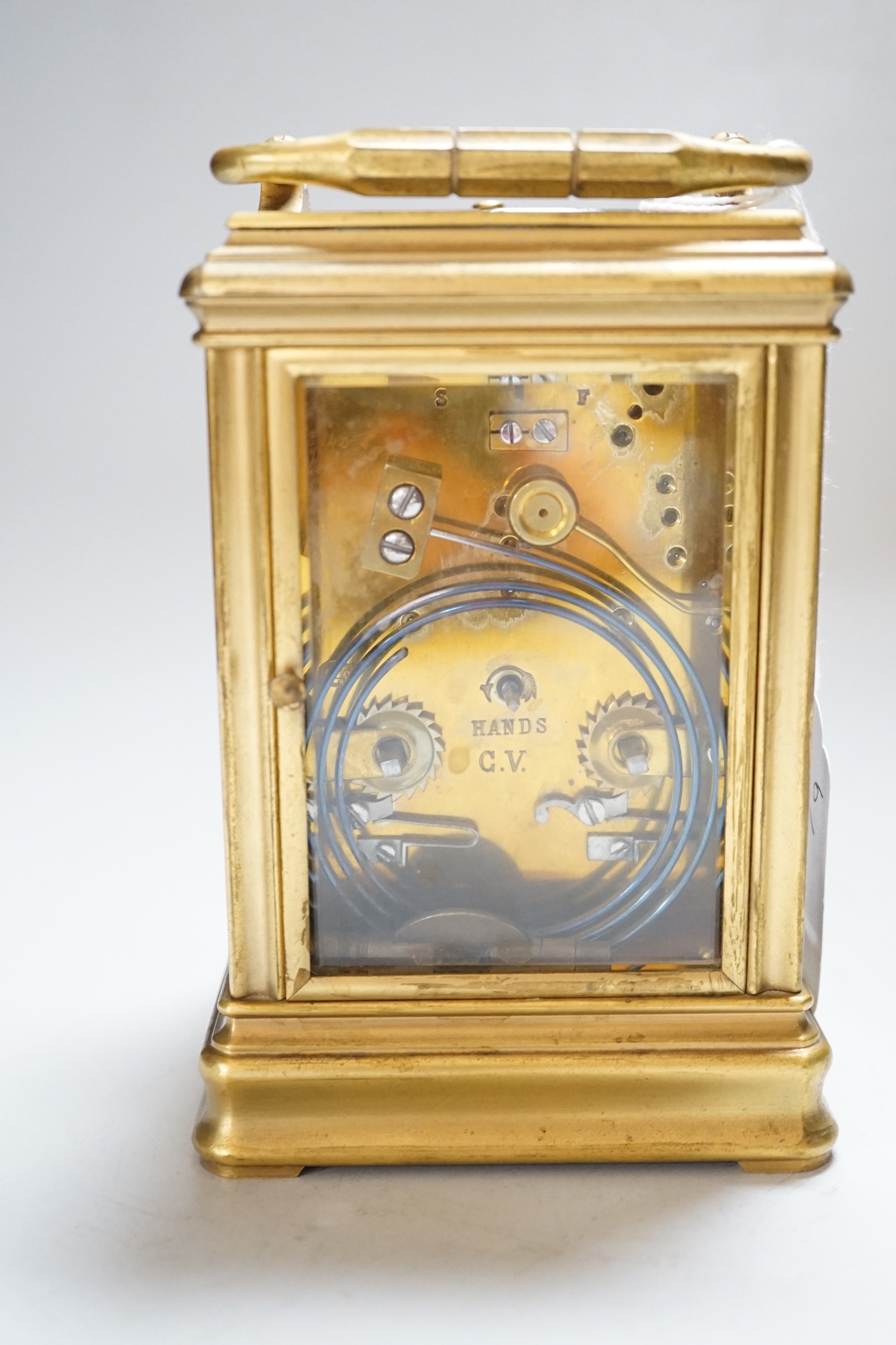 A late 19th century French ormolu, hour repeating carriage clock, with gorge case and enamelled Roman dial, 9.5cm wide, 8.5cm deep, 15cm high